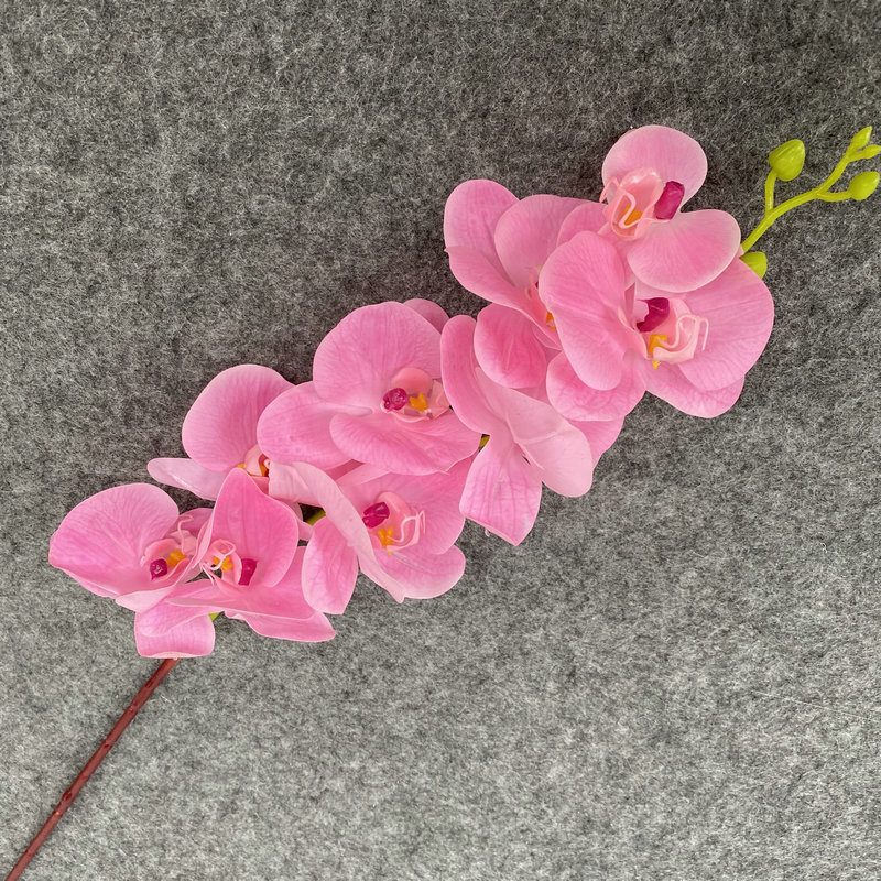 9 heads faux moth orchid is made of Film cloth and is available in 11 colors. Artificial orchids are mainly used for decoration and flower arrangement. Artificial orchids are common in home decoration and can be inserted in vases or pots to add vitality to living rooms, bedrooms and dining rooms. Orchids are beautiful and can mix with roses, hydrangeas, and lilies. Leafhometrade specializes in providing wholesale custom artificial plants.