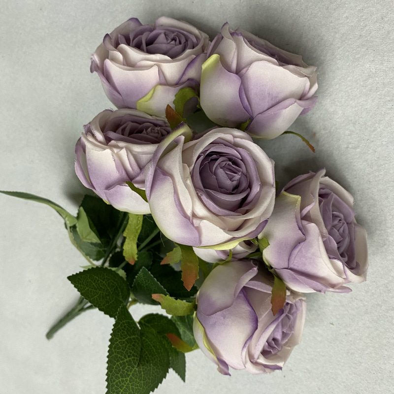 The Seven-Heads Rose Bouquet is a climbing rose made of fabric and available in 10 colors. Artificial roses are used for holiday parties and home decoration. Best match bouquets: delphinium, ball flower, milkweed, clematis, thistle, rose berry, terracotta rose, poet carnation, blueberry. Leafhometrade specializes in providing wholesale custom fake plants.