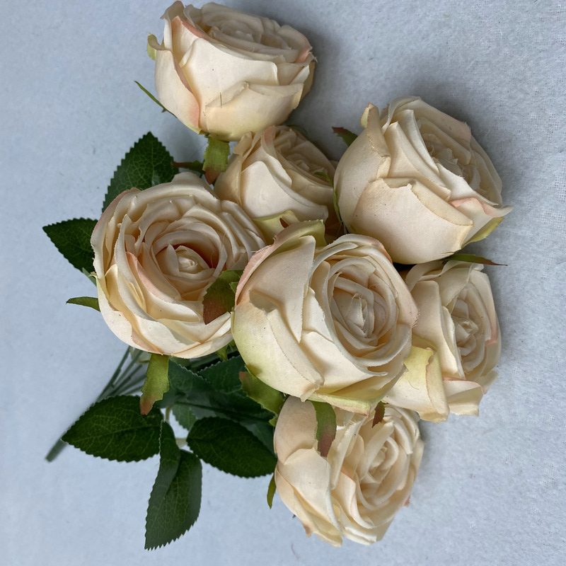 The Seven-Heads Rose Bouquet is a climbing rose made of fabric and available in 10 colors. Artificial roses are used for holiday parties and home decoration. Best match bouquets: delphinium, ball flower, milkweed, clematis, thistle, rose berry, terracotta rose, poet carnation, blueberry. Leafhometrade specializes in providing wholesale custom fake plants.