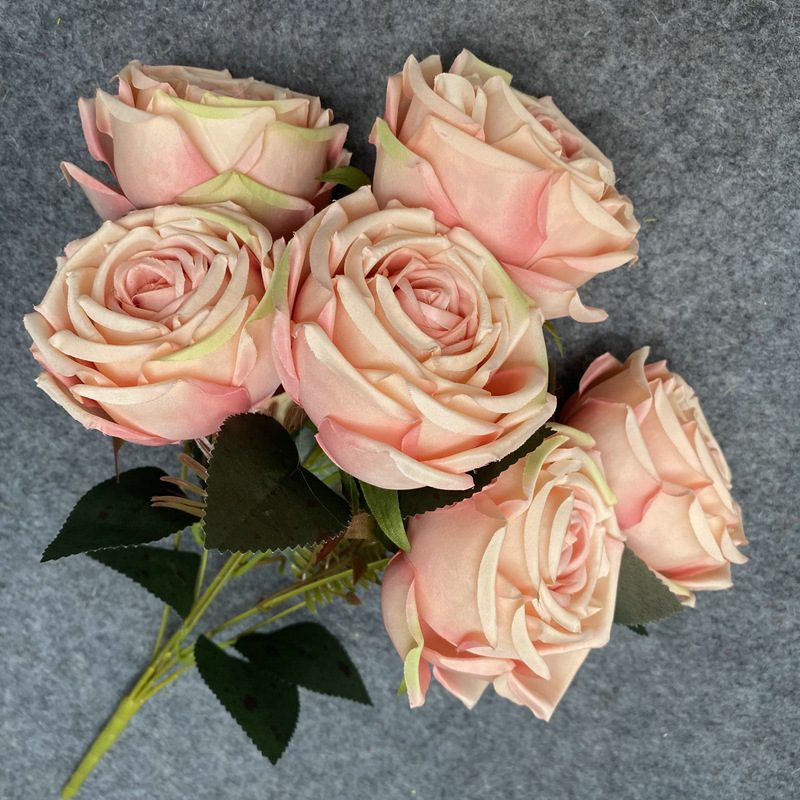 The seven-heads rose bouquet is a climbing rose made of fabric and available in 8 colors. Artificial roses are used for holiday parties and home decoration. Best match bouquets: delphinium, ball flower, milkweed, clematis, thistle, rose berry, terracotta rose, poet carnation, blueberry. Leafhometrade specializes in providing wholesale custom fake plants.