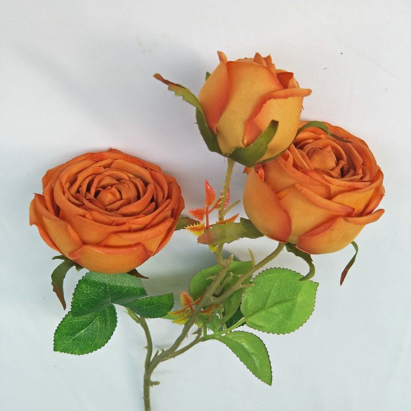 The three-heads rose bouquet is a climbing rose made of silk cloth and available in 8 colors. Artificial roses are used for holiday parties and home decoration. Best match bouquets: delphinium, ball flower, milkweed, clematis, thistle, rose berry, terracotta rose, poet carnation, blueberry. Leafhometrade specializes in providing wholesale custom fake plants.