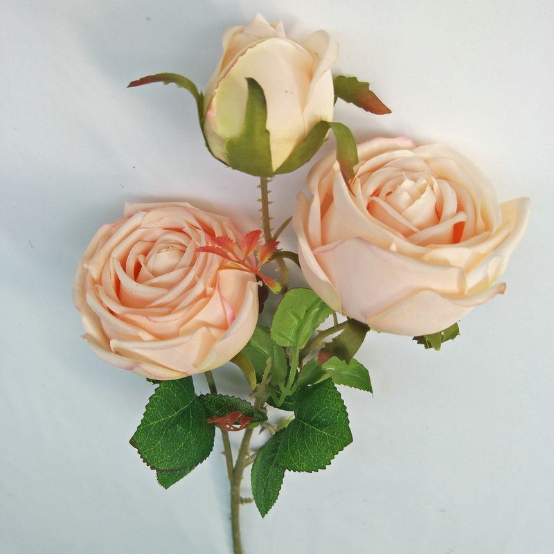 The three-heads rose bouquet is a climbing rose made of silk cloth and available in 8 colors. Artificial roses are used for holiday parties and home decoration. Best match bouquets: delphinium, ball flower, milkweed, clematis, thistle, rose berry, terracotta rose, poet carnation, blueberry. Leafhometrade specializes in providing wholesale custom fake plants.