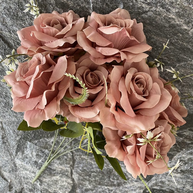 Artificial floral arrangements are Floribunda Roses, made of 240 woolen cloth, and available in 25 colors. Artificial rose flowers are used for wedding decoration and party decoration. Leafhometrade specializes in providing wholesale custom artificial flowers.