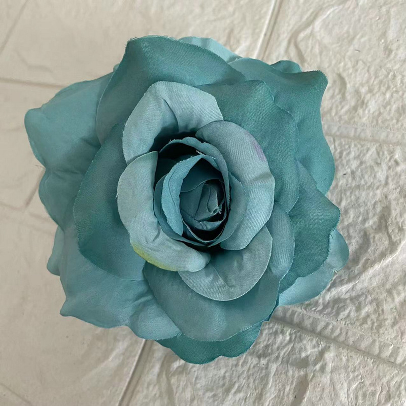 Faux Rose flowers head are Floribunda Rosess, made of silk cloth, available in 18 colors. Artificial rose flowers are used for home decoration and wedding flower decoration. Leafhometrade specializes in providing wholesale custom artificial plants.