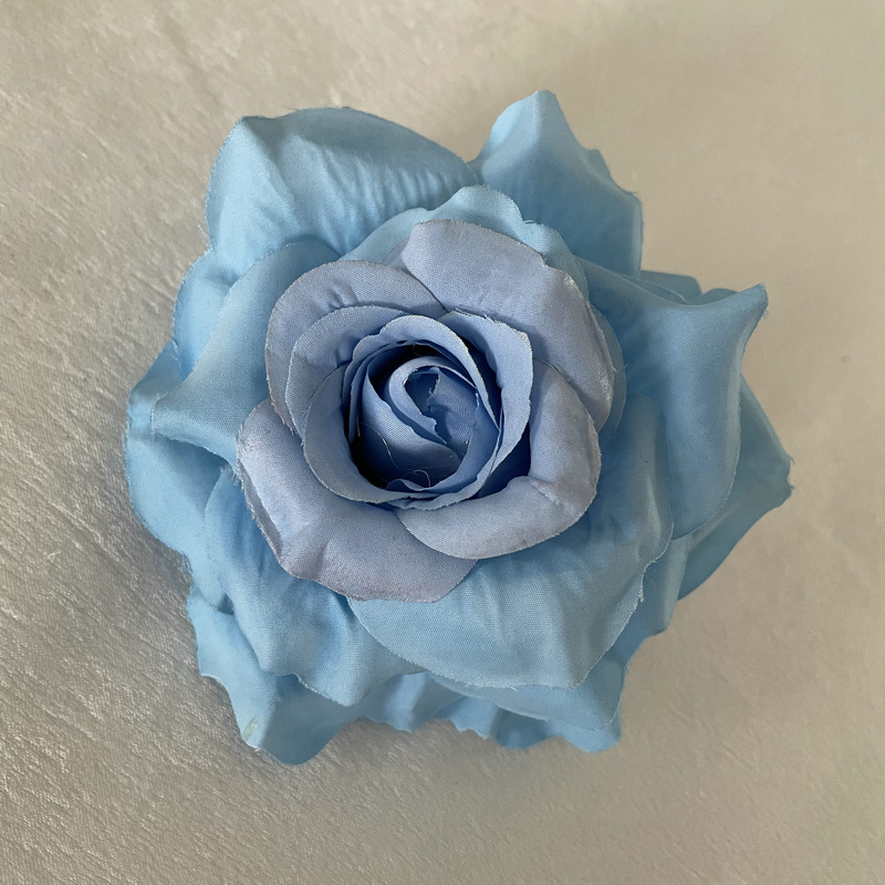 Faux Rose flowers head are Floribunda Rosess, made of silk cloth, available in 18 colors. Artificial rose flowers are used for home decoration and wedding flower decoration. Leafhometrade specializes in providing wholesale custom artificial plants.