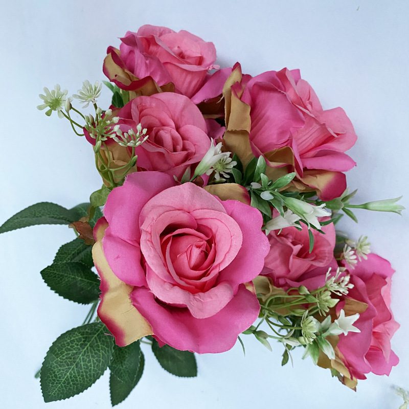 The artificial flowers are Floribunda Roses made from brushed fabric and are available in 16 colors. Artificial rose flowers are used for home decoration and wedding flower arrangements. Leafhometrade specializes in providing wholesale custom artificial plants.