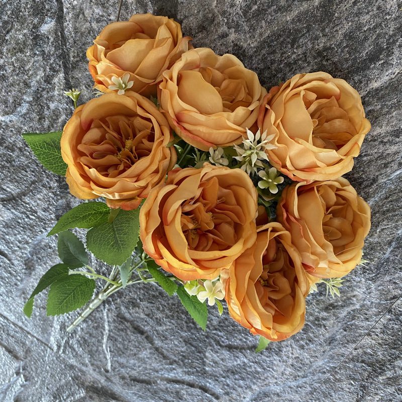 The artificial flowers are Garden Rose, made of fabric cloth, and available in 15 colors. Artificial rose flowers are used for wedding decoration and party decoration. Leafhometrade specializes in providing wholesale custom artificial flowers.