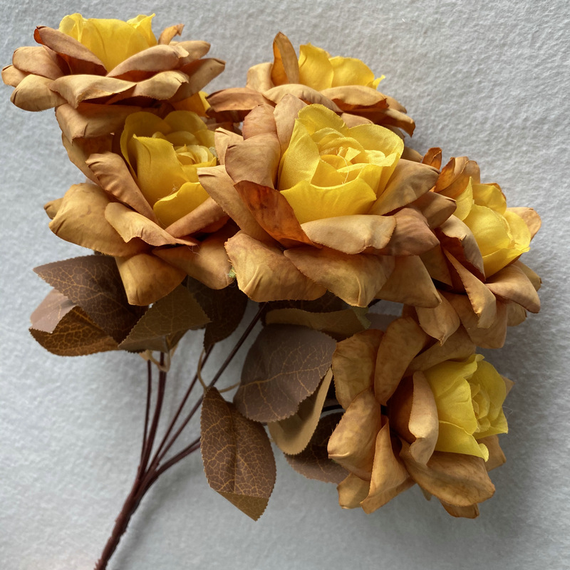 7 heads rose bouquet is a hybrid tea rose, made of silk cloth and has 10 colors to choose from. Artificial roses are used in home decoration and photography layout props. Leafhometrade specializes in providing wholesale customized artificial plants.