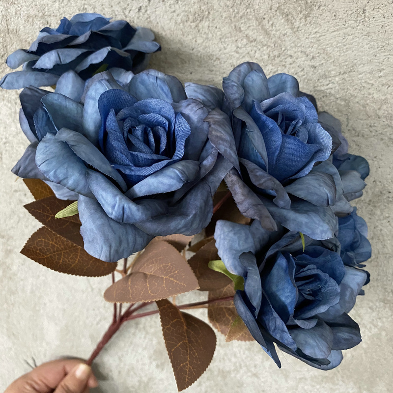 7 heads rose bouquet is a hybrid tea rose, made of silk cloth and has 10 colors to choose from. Artificial roses are used in home decoration and photography layout props. Leafhometrade specializes in providing wholesale customized artificial plants.