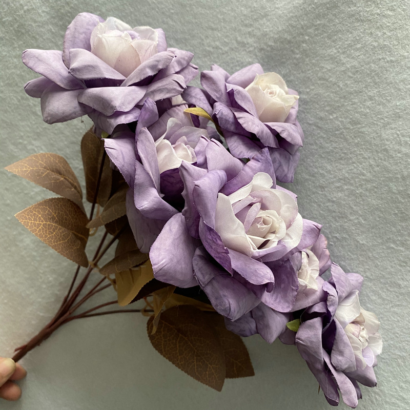 7 heads rose bouquet is a hybrid tea rose, made of silk cloth and has 10 colors to choose from. Artificial roses are used in home decoration and photography layout props. Leafhometrade specializes in providing wholesale customized artificial plants.