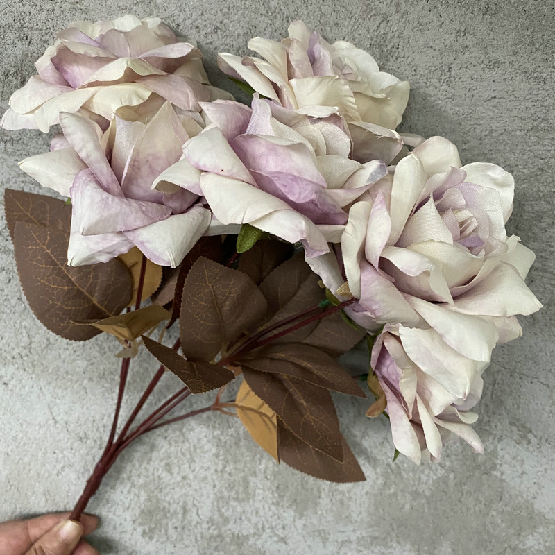 7 heads rose bouquet is a hybrid tea rose, made of silk cloth and has 10 colors to choose from. Artificial roses are used in home decoration and photography layout props. Leafhometrade specializes in providing wholesale customized artificial plants.