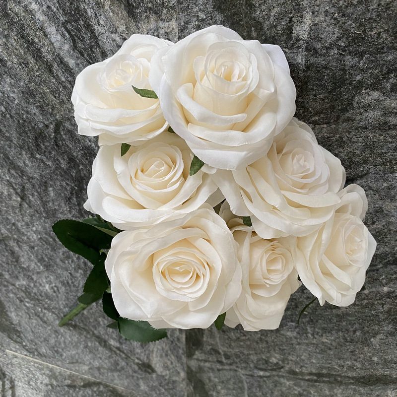 7 heads rose bouquet is a hybrid tea rose, made of silk cloth and has 29 colors to choose from. Artificial roses are used in plant wall and arch decoration. Leafhometrade specializes in providing wholesale customized artificial plants.