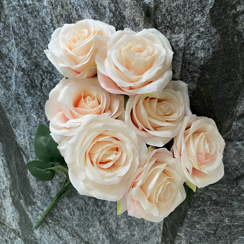 7 heads rose bouquet is a hybrid tea rose, made of silk cloth and has 29 colors to choose from. Artificial roses are used in plant wall and arch decoration. Leafhometrade specializes in providing wholesale customized artificial plants.