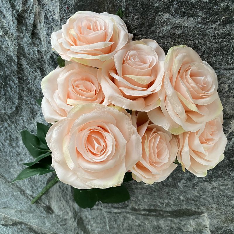 7 heads rose bouquet is a hybrid tea rose, made of silk cloth and has 29 colors to choose from. Artificial roses are used in plant wall and arch decoration. Leafhometrade specializes in providing wholesale customized artificial plants.