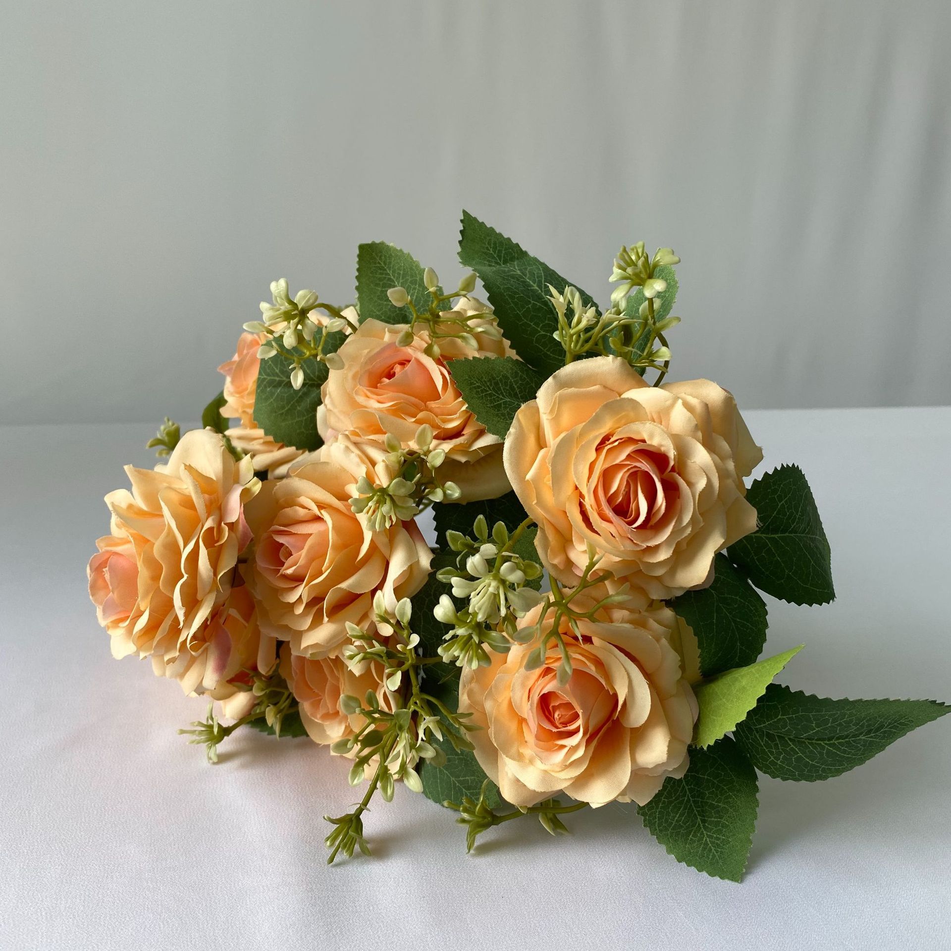 9 heads rose bouquet is a hybrid tea rose, made of Brushed cloth and has 8 colors to choose from. Artificial roses are used in home decoration and wedding decoration flowers. Leafhometrade specializes in providing wholesale customized artificial plants.