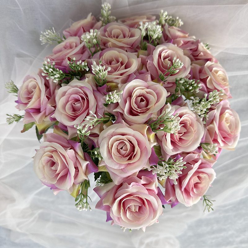 18 heads rose bouquet is a hybrid tea rose, made of silk cloth and has 13 colors to choose from. Artificial roses are used in plant wall and arch decoration. Leafhometrade specializes in providing wholesale customized artificial plants.