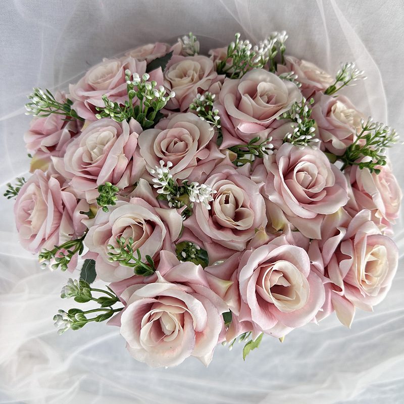 18 heads rose bouquet is a hybrid tea rose, made of silk cloth and has 13 colors to choose from. Artificial roses are used in plant wall and arch decoration. Leafhometrade specializes in providing wholesale customized artificial plants.