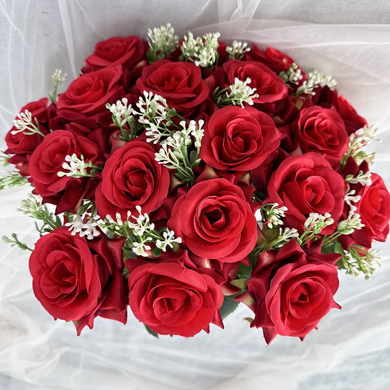 18 heads rose bouquet is a hybrid tea rose, made of silk cloth and has 13 colors to choose from. Artificial roses are used in plant wall and arch decoration. Leafhometrade specializes in providing wholesale customized artificial plants.