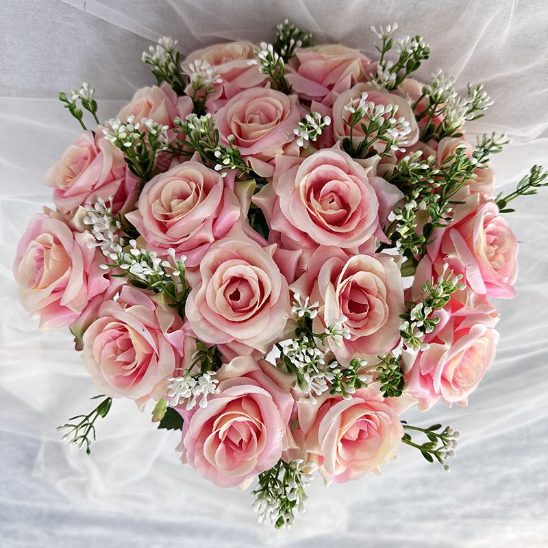 18 heads rose bouquet is a hybrid tea rose, made of silk cloth and has 13 colors to choose from. Artificial roses are used in plant wall and arch decoration. Leafhometrade specializes in providing wholesale customized artificial plants.