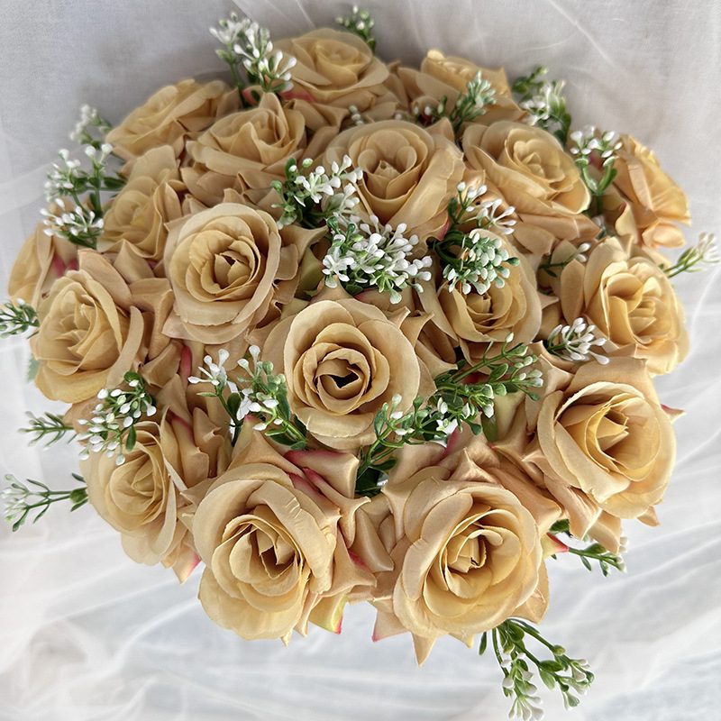 18 heads rose bouquet is a hybrid tea rose, made of silk cloth and has 13 colors to choose from. Artificial roses are used in plant wall and arch decoration. Leafhometrade specializes in providing wholesale customized artificial plants.