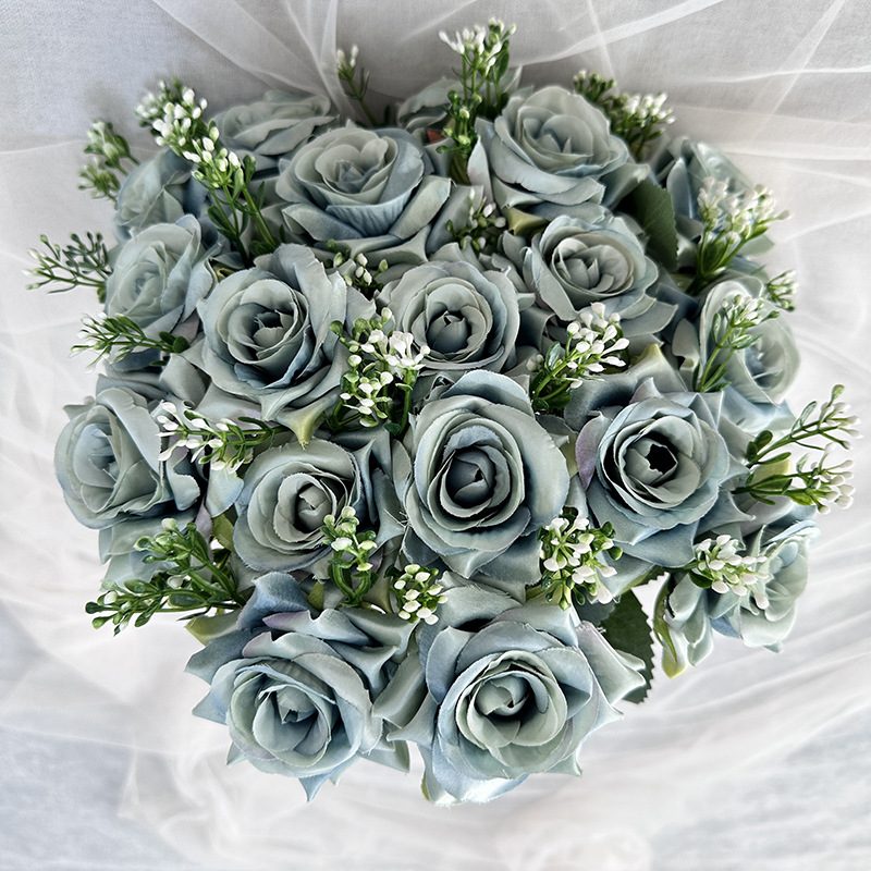 18 heads rose bouquet is a hybrid tea rose, made of silk cloth and has 13 colors to choose from. Artificial roses are used in plant wall and arch decoration. Leafhometrade specializes in providing wholesale customized artificial plants.