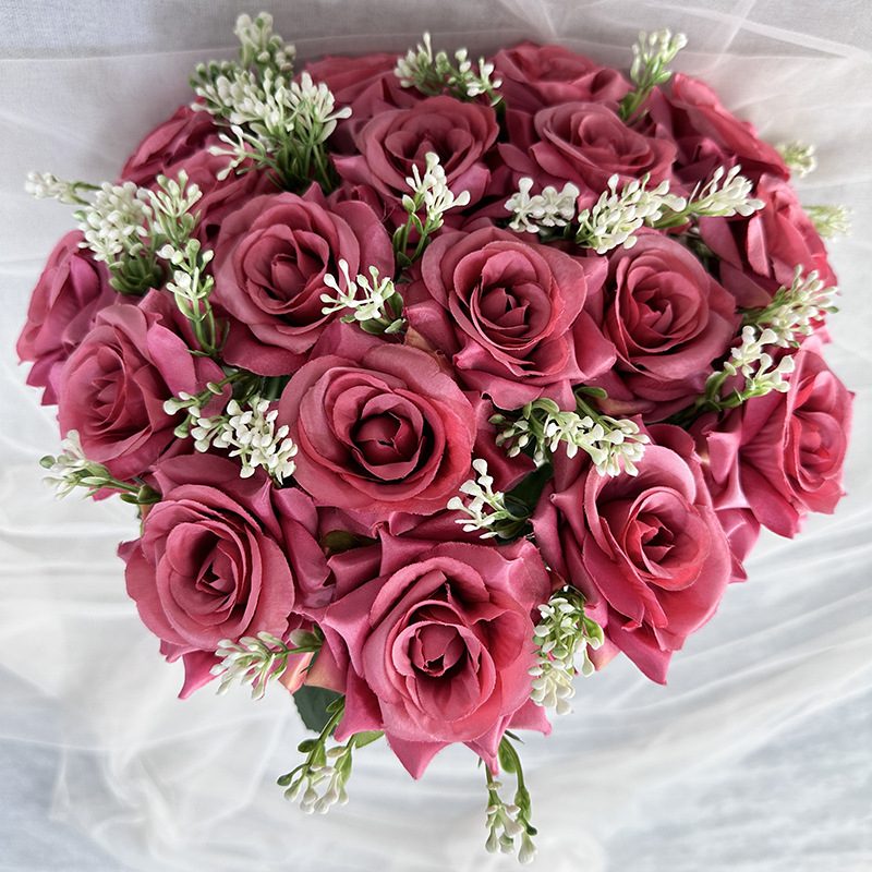 18 heads rose bouquet is a hybrid tea rose, made of silk cloth and has 13 colors to choose from. Artificial roses are used in plant wall and arch decoration. Leafhometrade specializes in providing wholesale customized artificial plants.