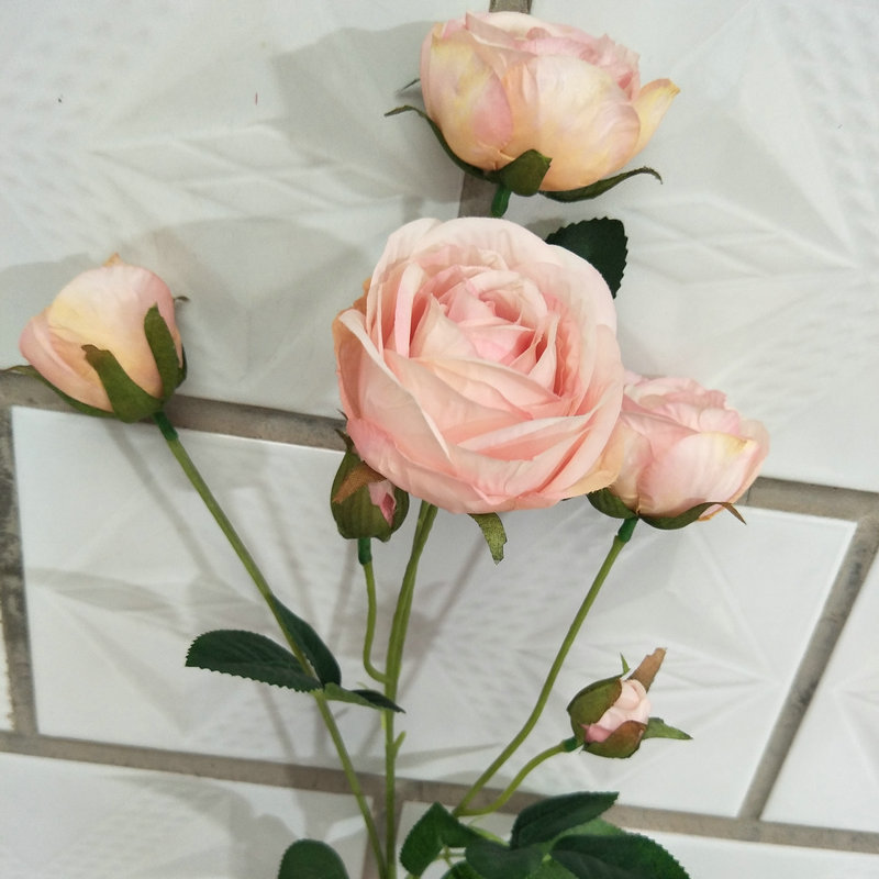 The outdoor artificial flowers are Shrub Rose, made of fabric cloth, and available in 14 colors. Artificial rose flowers are used for wedding reception decorations and party decoration. Leafhometrade specializes in providing wholesale custom artificial flowers.