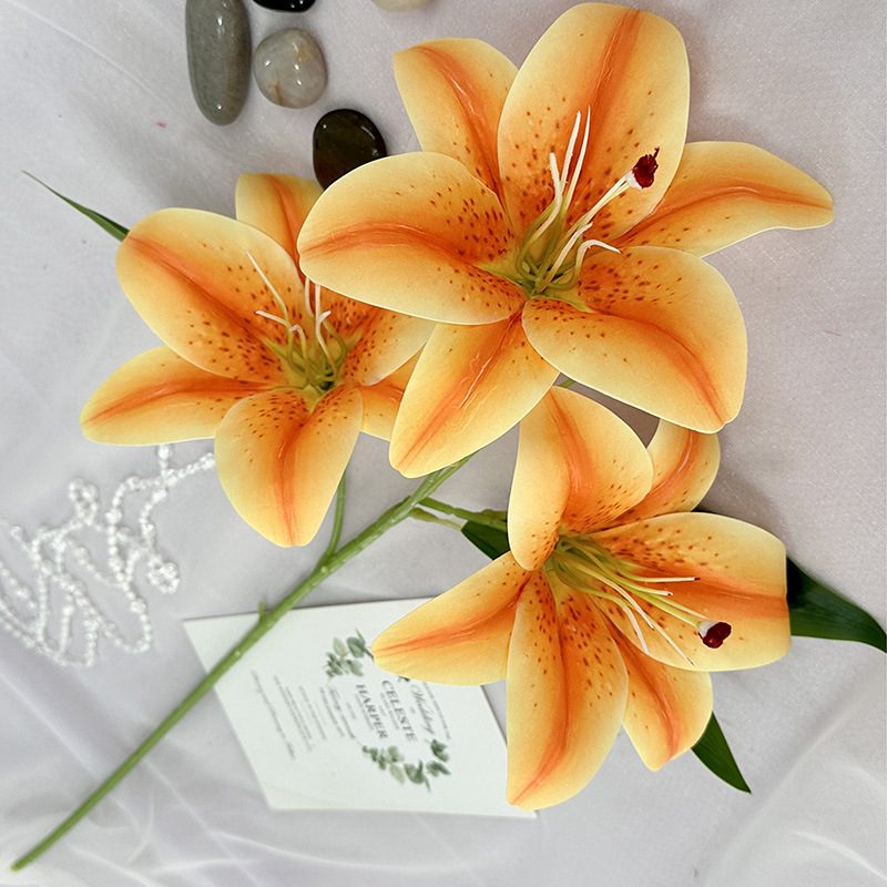 Fake lily flowers are made of 3D printing cloth, available in 10 colors. Lily artificial flowers are used for Car Decor、Exhibition、Home Decor、Hotel Decor、Office Decor. In terms of décor, the Peace Lily can be used as a focal point in a room or as a complement to other decorative elements. . Lily flower arrangement can be matched with Delphinium、Viburnum、Hydrangea、Roses、Jasmine、Celosia、Miscanthus、Zinnias、Cosmos、Branches、dahlias、button poms、Ruscus、Chrysanthemums、Grasses and greenery ect. Leafhometrade specializes in providing wholesale custom artificial plants.