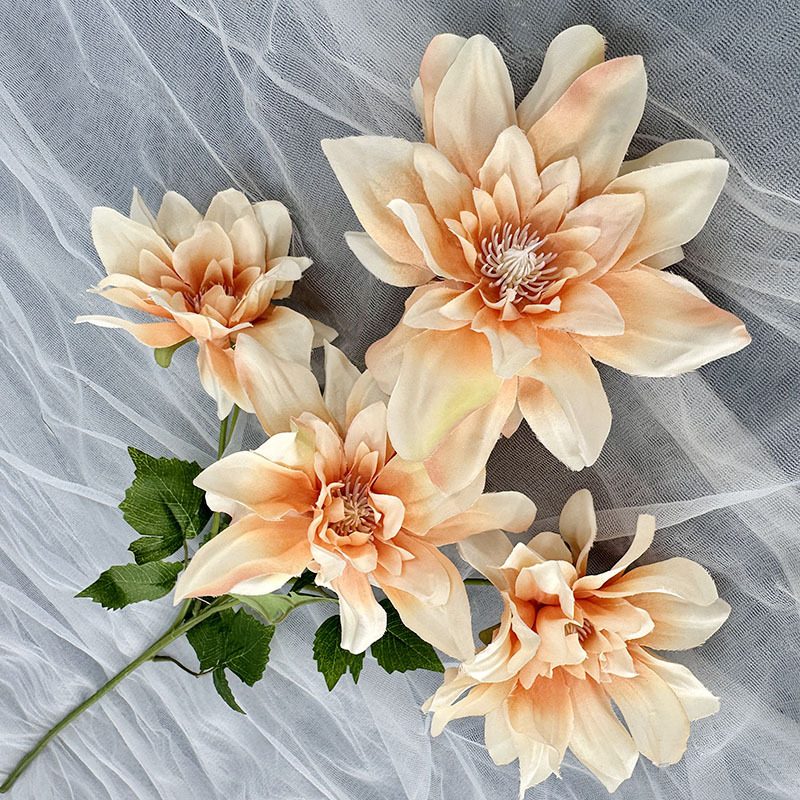 Faux Dahlia Flowers is made of silk cloth and is available in 8 colors. Dahlia Flower Arrangement are used for wedding decorations, hotel lobbies, parties and other ceremonies. Artificial dahlia flower arrangements can be paired with roses, hydrangeas, sunflowers, chrysanthemums, green greenery stem, etc. Leafhometrade specializes in providing wholesale custom artificial plants.