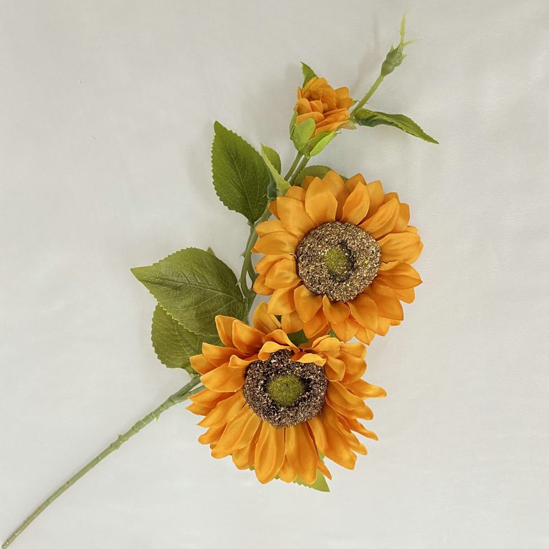 Fake sunflower bouquet are made of silk cloth, available in 9 colors. Artificial sunflower arrangements are particularly suitable for decorating tables, as wall and door decorations or as vase flowers.. Sunflower flower arrangements can be paired with seasonal leaves, roses, eucalyptus leaves, chrysanthemums, sage, daisies, carnations, lilies, delphiniums, gerberas, lilies and daffodils. Leafhometrade specializes in providing wholesale custom artificial plants.