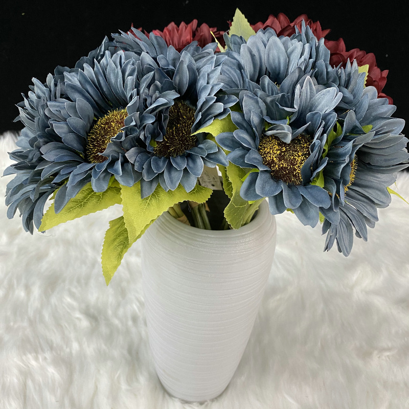 Fake sunflower bouquet are made of Matt cloth, available in 8 colors. Artificial sunflower arrangements are particularly suitable for decorating tables, as wall and door decorations or as vase flowers.. Sunflower flower arrangements can be paired with seasonal leaves, roses, eucalyptus leaves, chrysanthemums, sage, daisies, carnations, lilies, delphiniums, gerberas, lilies and daffodils. Leafhometrade specializes in providing wholesale custom artificial plants.