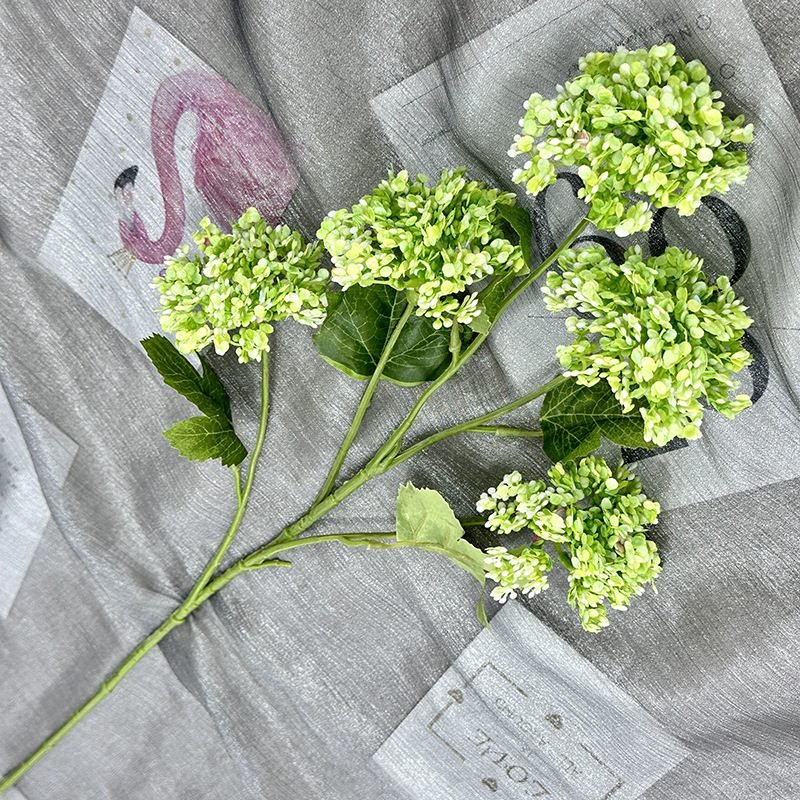 Artificial hydrangeas are made of plastic cloth, available in 11 colors. Artificial hydrangeas flowers are used for ‎Home decoration, party venue decoration, wedding venue decoration, exquisite bouquet design, flower box design, flower basket design. Hydrangea flower arrangements can be paired with delphiniums, freesias, foxgloves, greenery, bells, and more. Use hydrangeas in different colors to create a more vibrant floral arrangement for special occasions. Add some greenery to your flower arrangement to fill in the gaps and add visual interest. Use a vase or container in the same color as the hydrangeas for a more cohesive look. Leafhometrade specializes in providing wholesale custom artificial plants.