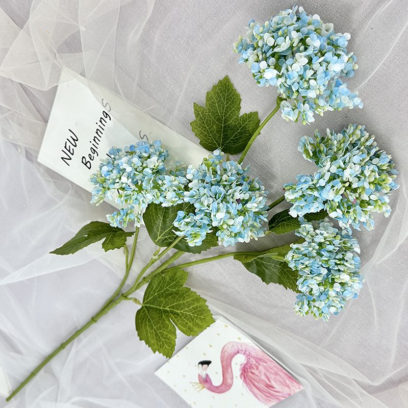 Artificial hydrangeas are made of plastic cloth, available in 11 colors. Artificial hydrangeas flowers are used for ‎Home decoration, party venue decoration, wedding venue decoration, exquisite bouquet design, flower box design, flower basket design. Hydrangea flower arrangements can be paired with delphiniums, freesias, foxgloves, greenery, bells, and more. Use hydrangeas in different colors to create a more vibrant floral arrangement for special occasions. Add some greenery to your flower arrangement to fill in the gaps and add visual interest. Use a vase or container in the same color as the hydrangeas for a more cohesive look. Leafhometrade specializes in providing wholesale custom artificial plants.