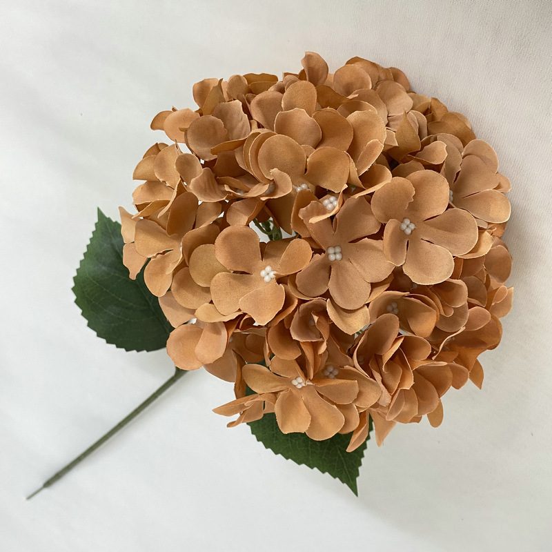 Artificial hydrangeas are made of fabric cloth, available in 12 colors. Artificial hydrangeas flowers are used for ‎Home decoration, party venue decoration, wedding venue decoration, exquisite bouquet design, flower box design, flower basket design. Hydrangea flower arrangements can be paired with delphiniums, freesias, foxgloves, greenery, bells, and more. Use hydrangeas in different colors to create a more vibrant floral arrangement for special occasions. Add some greenery to your flower arrangement to fill in the gaps and add visual interest. Use a vase or container in the same color as the hydrangeas for a more cohesive look. Leafhometrade specializes in providing wholesale custom artificial hydrangea flower.