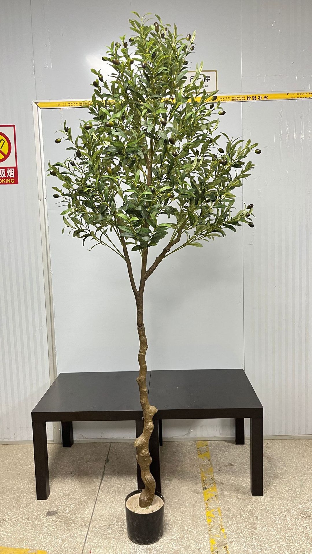 Faux Olive Tree are made of PE, iron wire, silk screen cloth, expanded polystyrene. Artificial trees with extremely realistic appearance can decorate hotels, casinos, restaurants, shopping malls, retail stores, apartment and office buildings, theaters, stadiums and private homes. Artificial trees can be reused for many years, which makes the initial investment a significant saving in the long run, especially when you consider the maintenance costs required for certain types of trees. Once installed, artificial trees require no maintenance, watering and cleaning, except for occasional dusting when the situation requires it. Leafhometrade specializes in providing wholesale custom artificial plants.