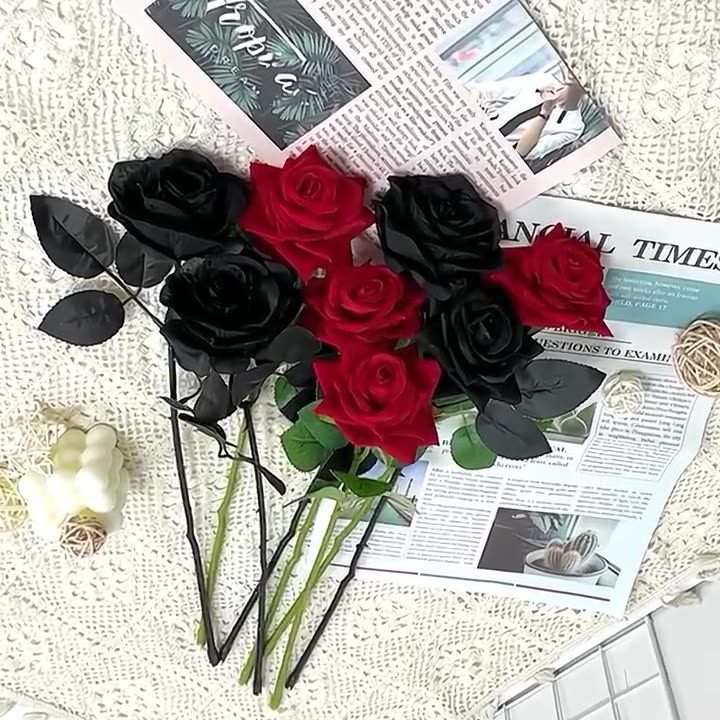 The black rose bouquet is made up of black roses, black rose leaves and black wire.