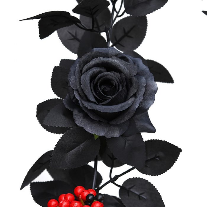 The artificial black rose garland is composed of black rose heads, black rose leaves, golden water plants, and red berries.