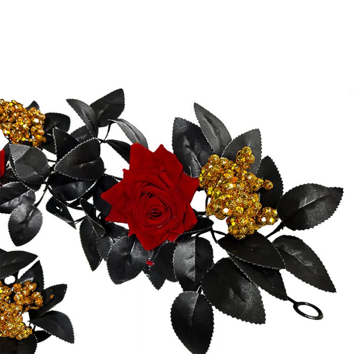 The artificial black rose garland is composed of black rose heads, black rose leaves, golden water plants, and red berries.